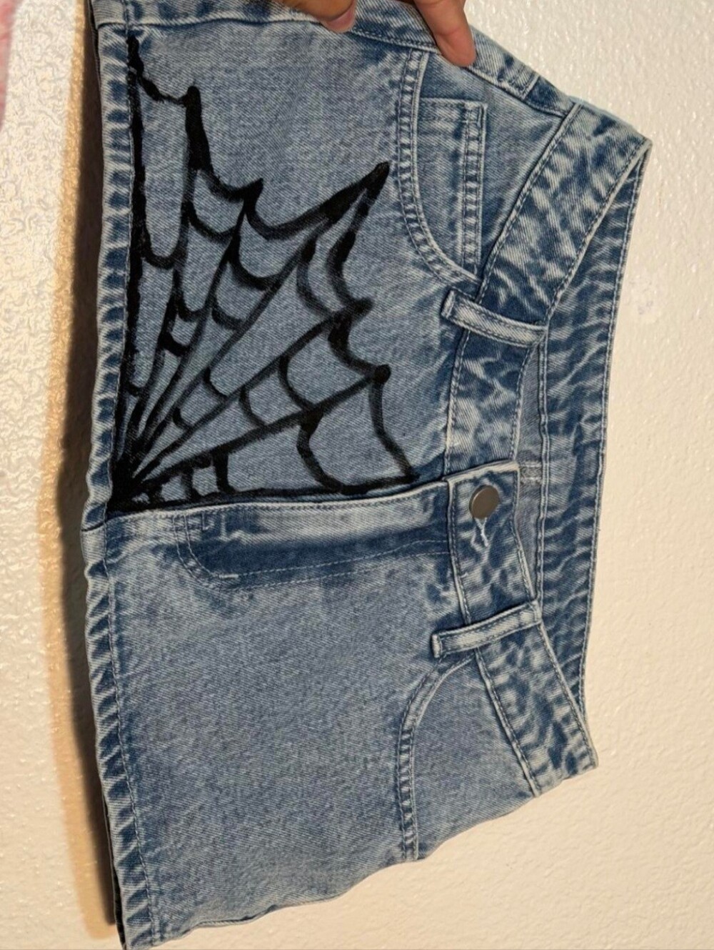 SHEIN Light Blue Denim Shorts with Black Spiderweb Accent